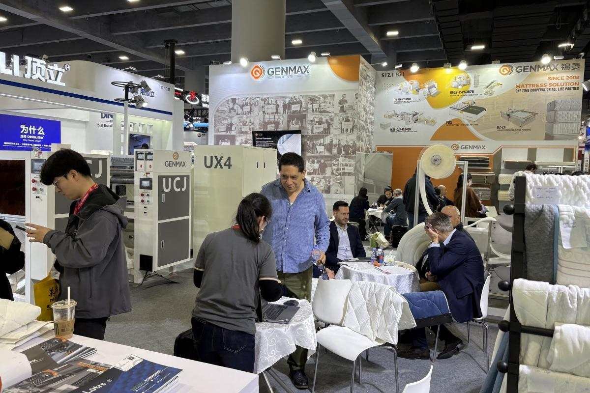 GENMAX engineer and customer discussing machine customization options to meet specific production needs at CIFF.