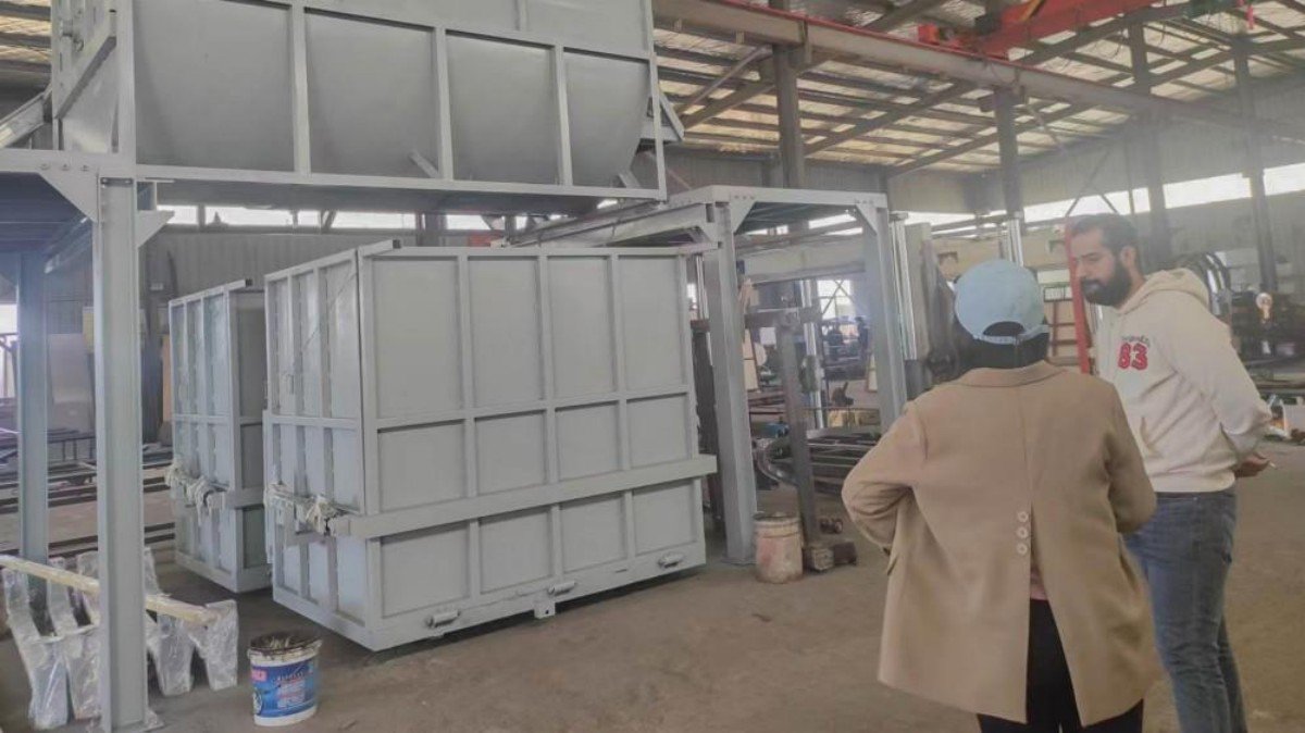 Colombian customers carefully examining the technical components of an industrial sponge production line machinery during their factory visit to evaluate foam manufacturing equipment.