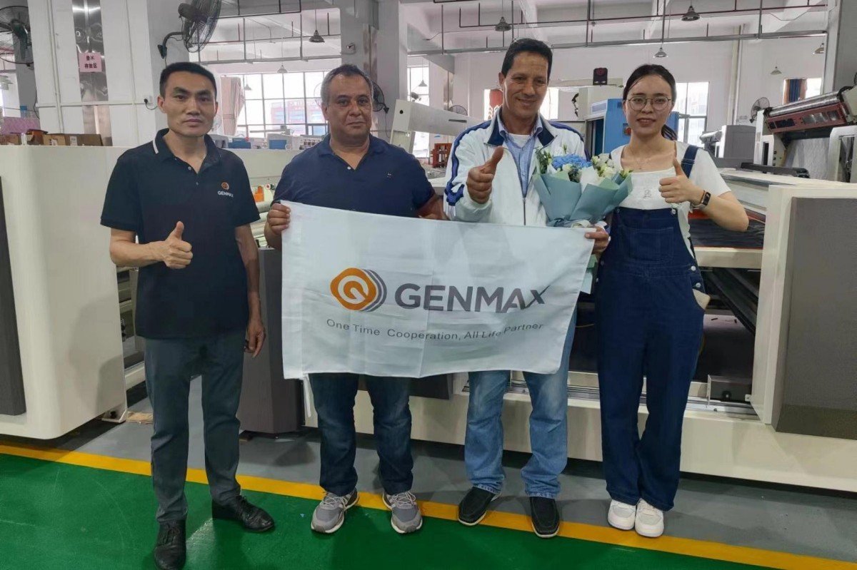 Moroccan textile professionals examining Genmax industrial quilting machines during a factory tour with Genmax sales representatives.