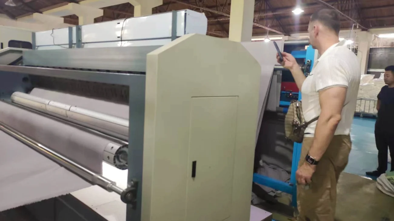 Customers watching the textile machine in operation to evaluate performance