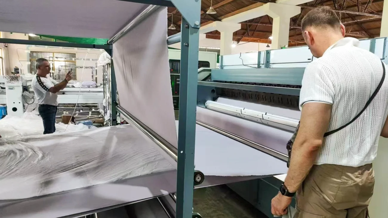 Customers observing fabric output directly from the textile manufacturing machine