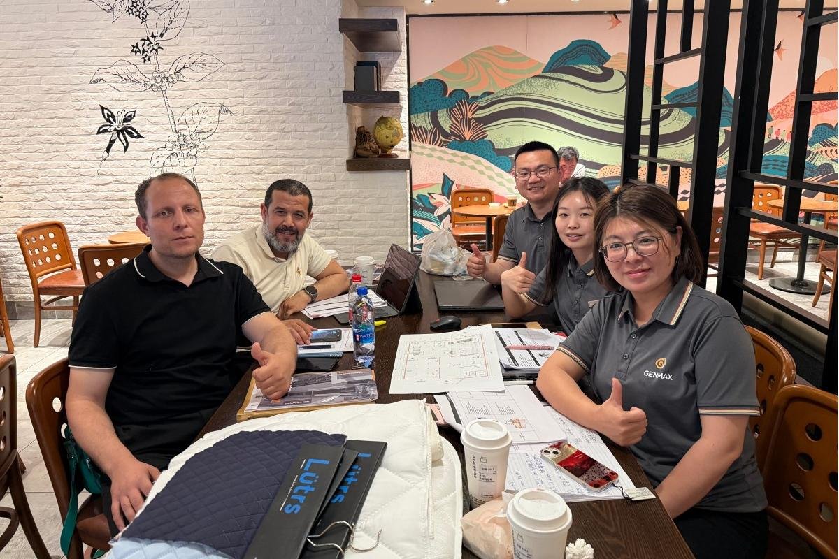 Group photo of Algerian mattress factory leaders and consultants taken at a coffee shop after a productive discussion about optimizing mattress production line solutions