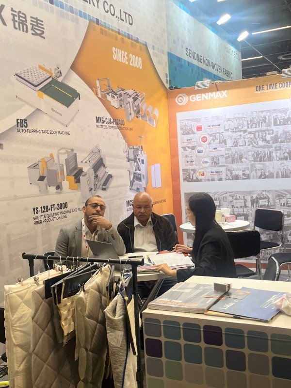 Preview of GENMAX's energy-efficient quilting machinery that helps manufacturers reduce operational costs, to be showcased at Interzum 2025 in Cologne.