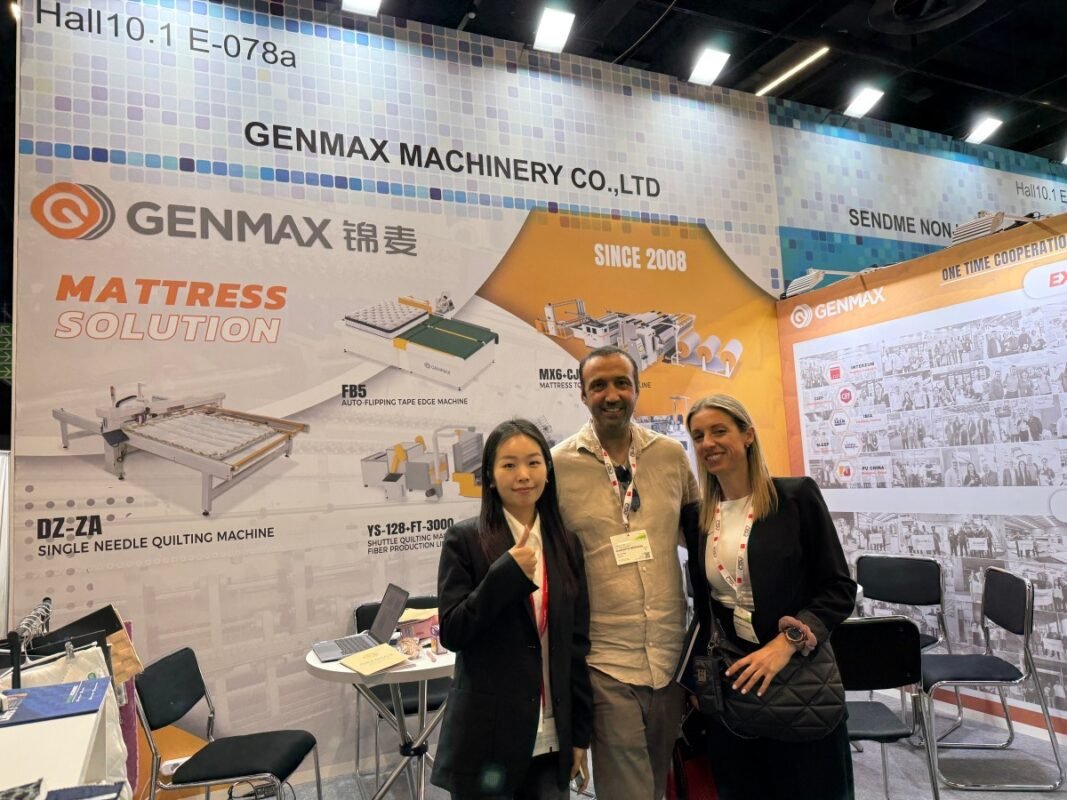 Representatives from Greek mattress manufacturing companies receiving detailed technical consultation on GENMAX quilting solutions during Interzum Cologne 2025