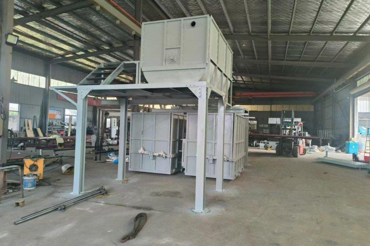 Wide-angle perspective of the industrial foam rebonding machinery installation showing the integration of mixing, molding and hydraulic pressing components in the factory setting.