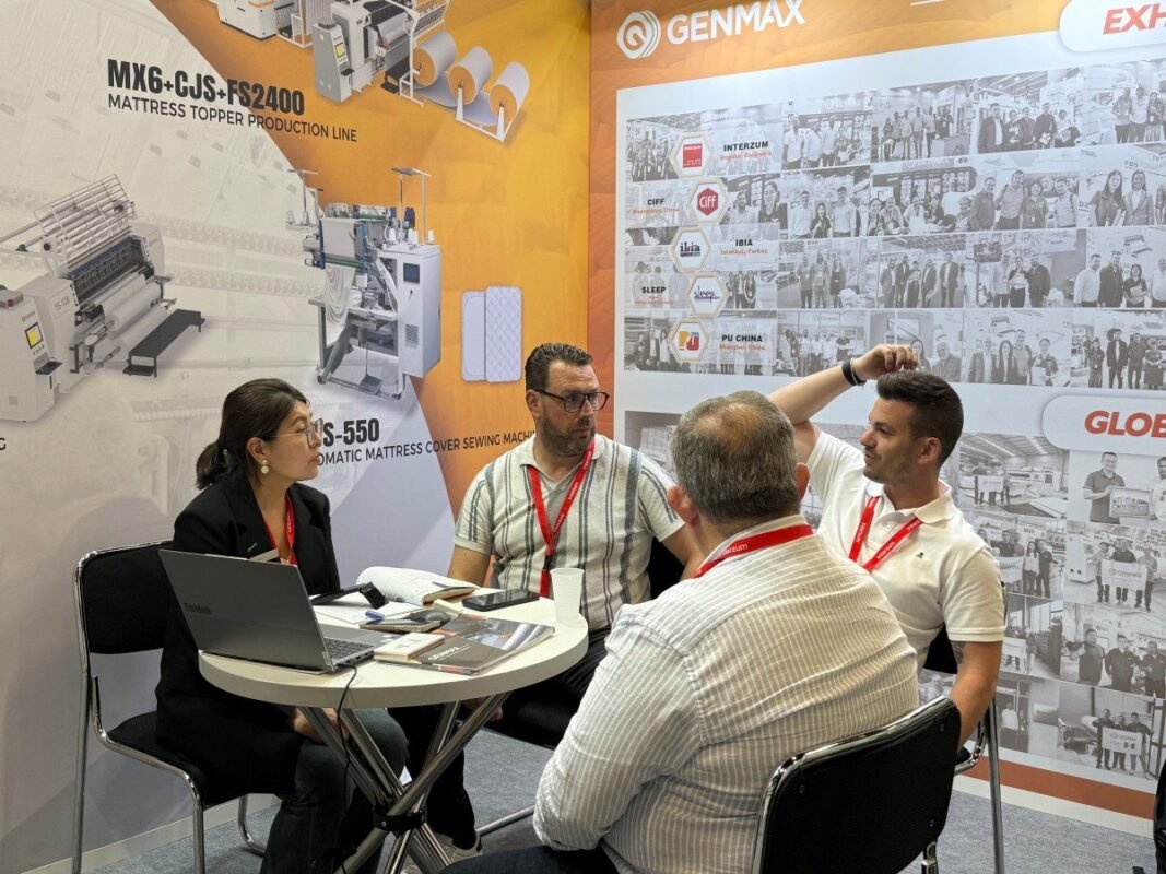 Long-term GENMAX customers reconnecting with the technical team at Interzum 2025 to discuss machinery upgrades and process optimization for their established production lines.
