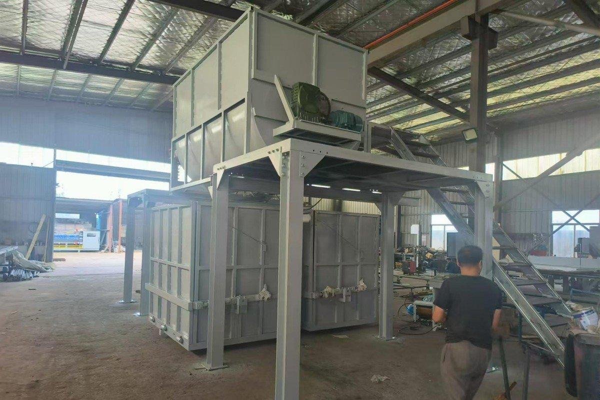 Detailed close-up view of the hydraulic press system on a recycled sponge production machine that compresses mixed foam particles to create rebonded foam products of precise density.