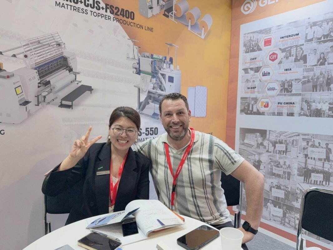 Small workshop owners receiving personalized equipment recommendations from GENMAX specialists during a scheduled consultation at Interzum Cologne 2025.